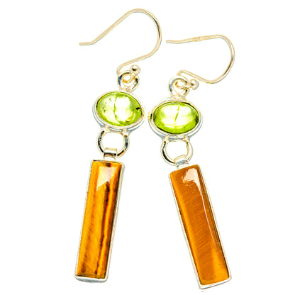Pair of sterling silver drop earrings with peridot-green orbs and tiger-eye bars