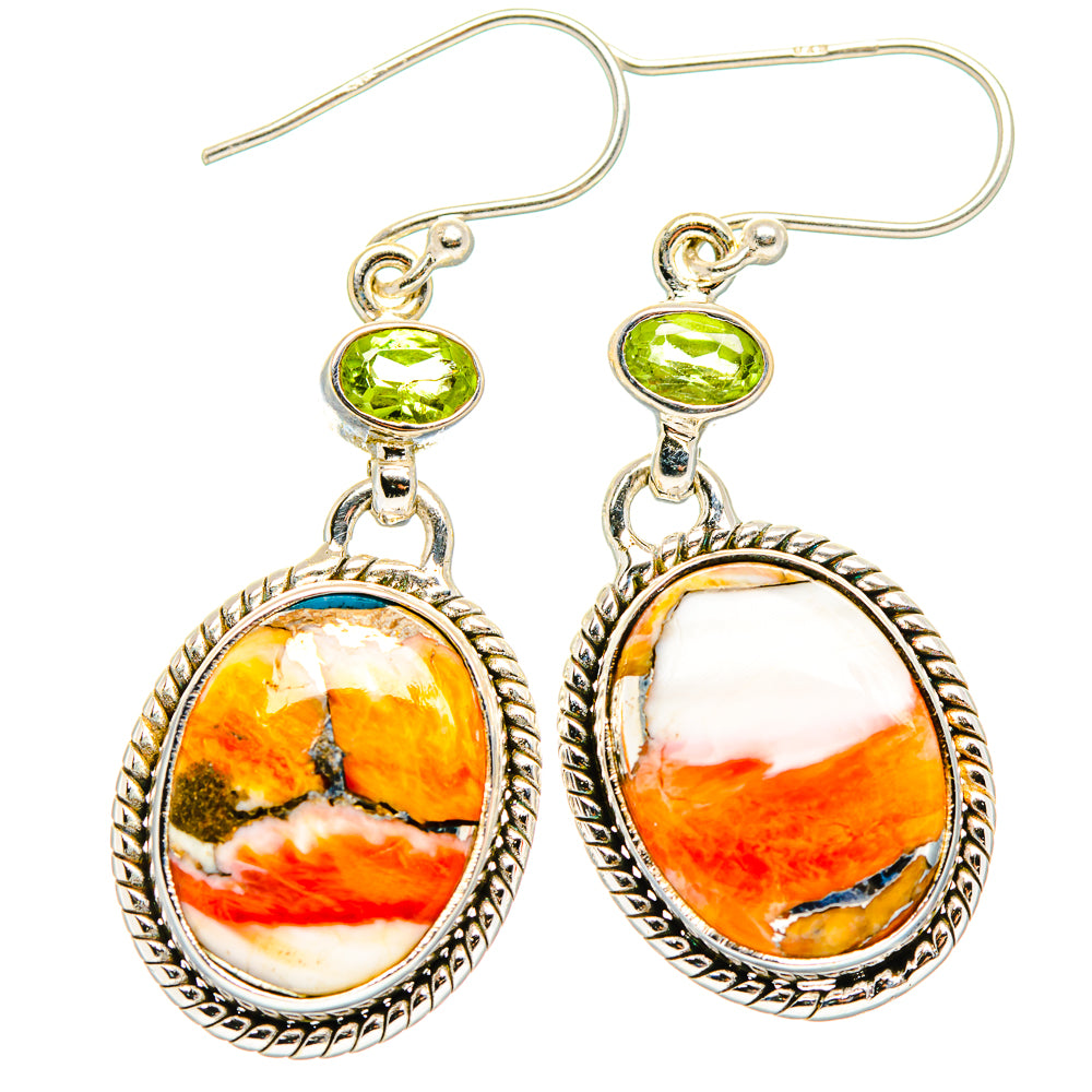 Sterling silver drop earrings with green peridot accents and oval spiny oyster cabochons