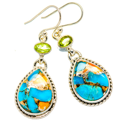 Turquoise teardrop chandelier earrings with green peridot stones and silver-tone hooks