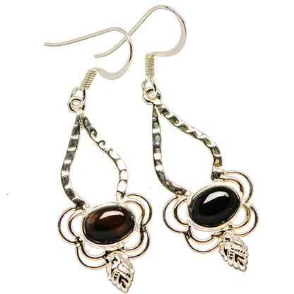 Sterling silver dangle earrings with black oval onyx-style stone, openwork teardrop, hooks