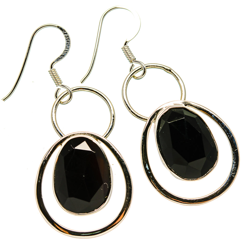 Black onyx drop earrings with oval faceted stones and silver circular hoops, fishhook backs.