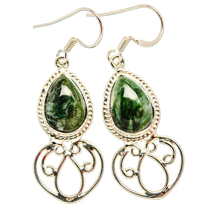Sterling silver earrings with green teardrop gemstone and ornate filigree heart dangle