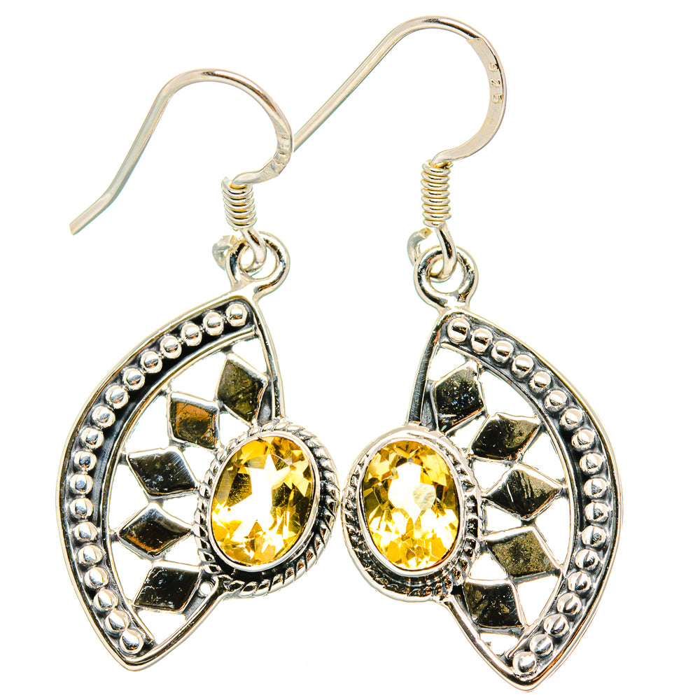 Sterling silver citrine oval drop earrings with faceted yellow stones and border