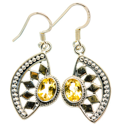 Sterling silver citrine oval drop earrings with faceted yellow stones and border