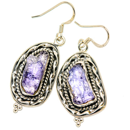 Sterling silver oval tanzanite drop earrings with rough purple gemstone, hook backs