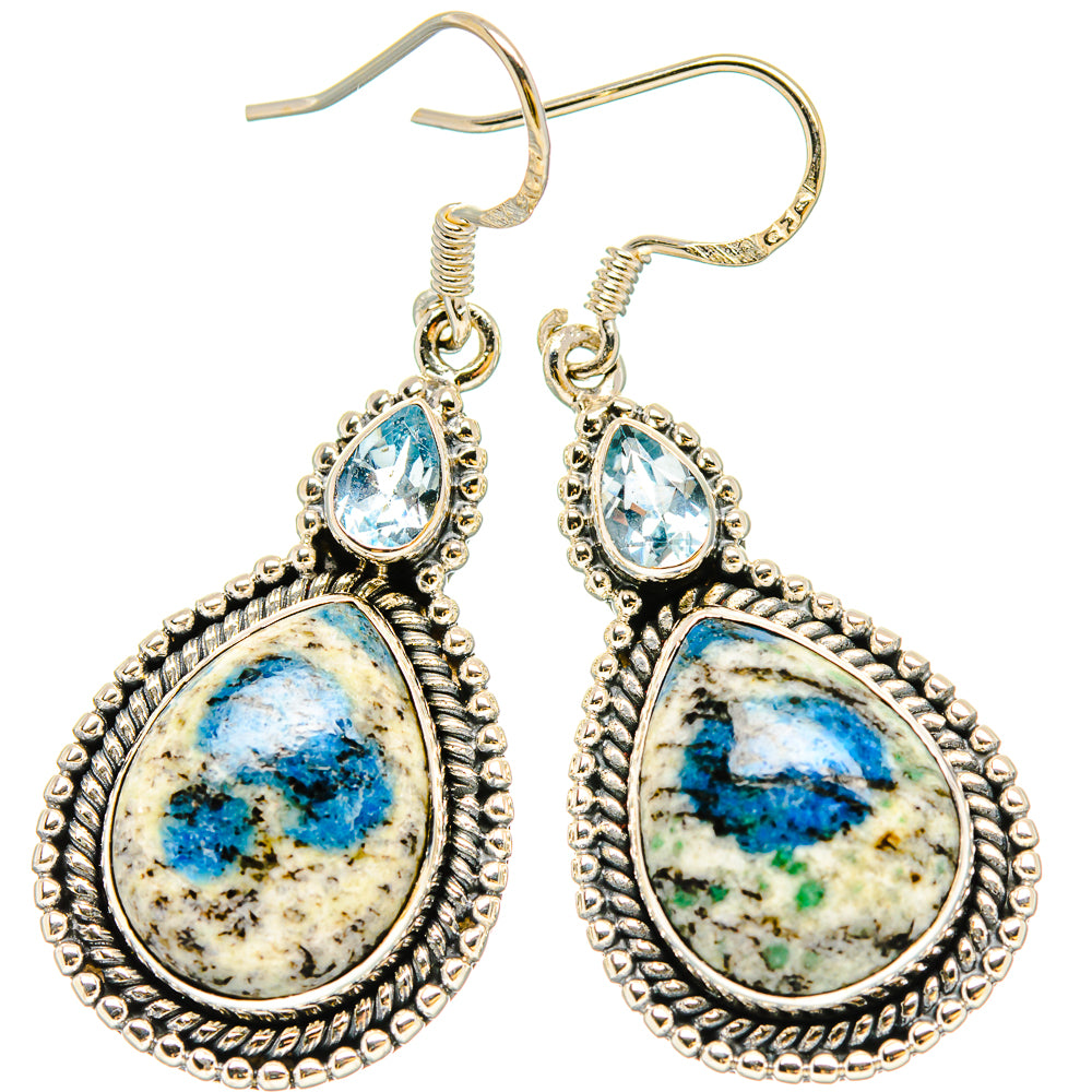 Sterling silver drop earrings with blue teardrop stones and textured oval frames