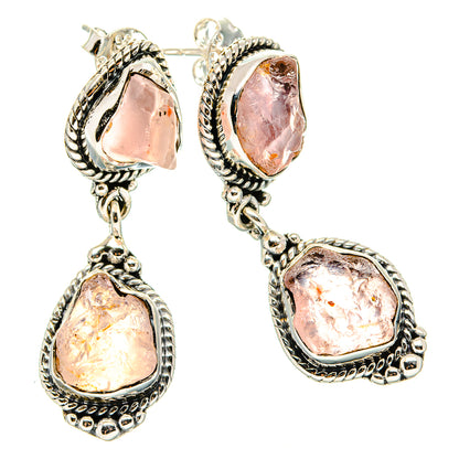 Sterling silver earrings with ornate frames and rough pink rose quartz drops