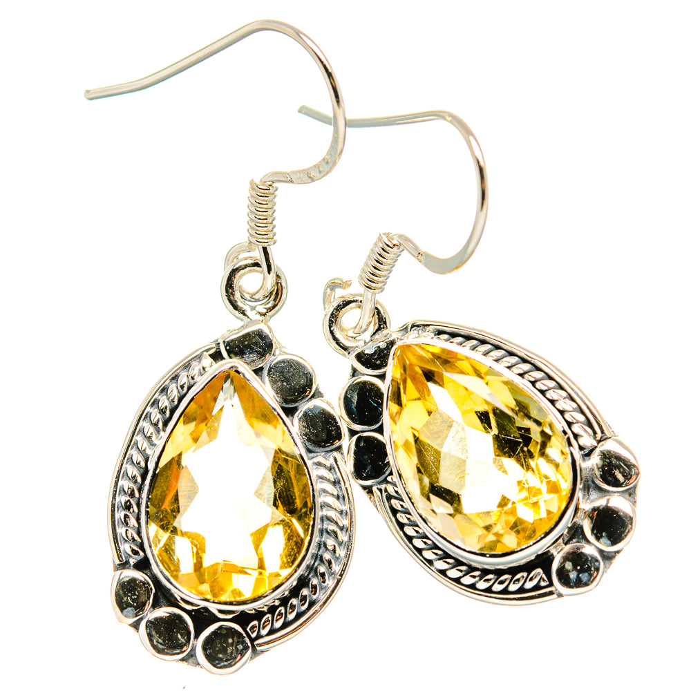 Sterling silver citrine drop earrings with faceted yellow stones and halo frame