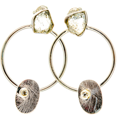 Sterling silver hoop earrings with rough white quartz tops and brushed oval charms