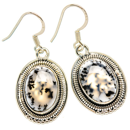 Sterling silver oval dendritic opal earrings with beaded halo bezel and fishhook settings