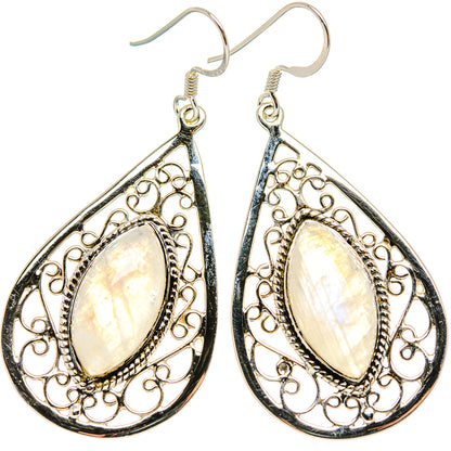 Teardrop moonstone drop earrings with silver filigree and pale iridescent stone