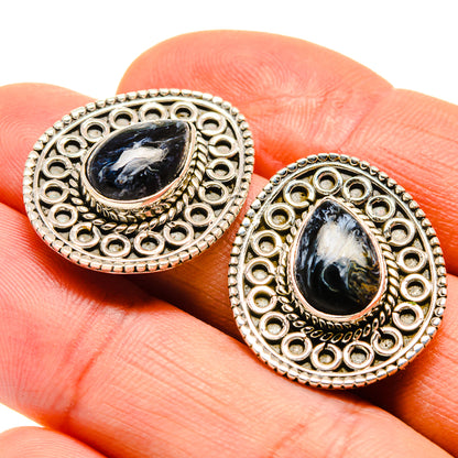 Sterling silver oval earrings with filigree border and dark blue pietersite-style stone