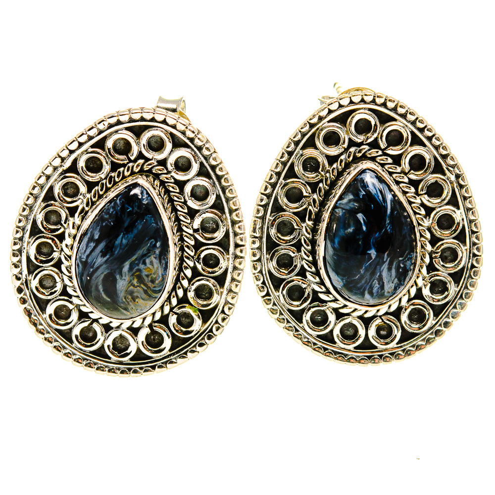 Sterling silver oval earrings with detailed round-cut filigree and blue teardrop stone