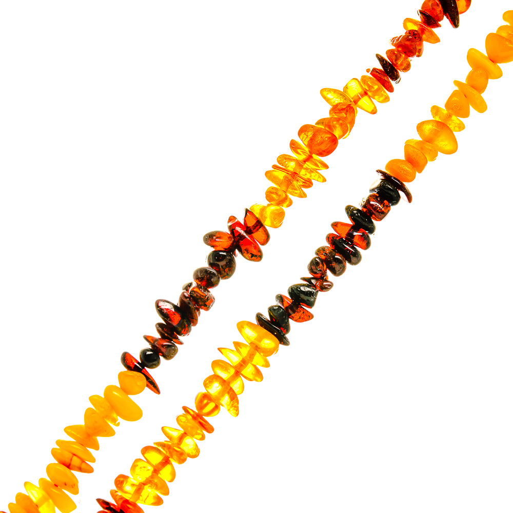 Baltic amber bead necklace showing long strand of orange and amber stones