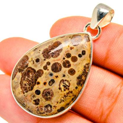 Poppy jasper teardrop pendant, 925 sterling silver bail; held in fingertips