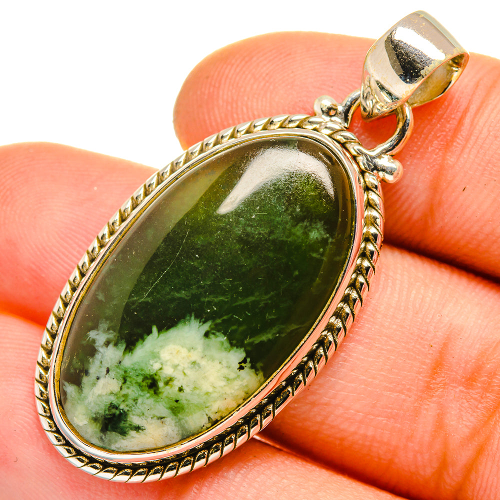Oval green nephrite jade pendant with rope-edge sterling silver bezel and bail
