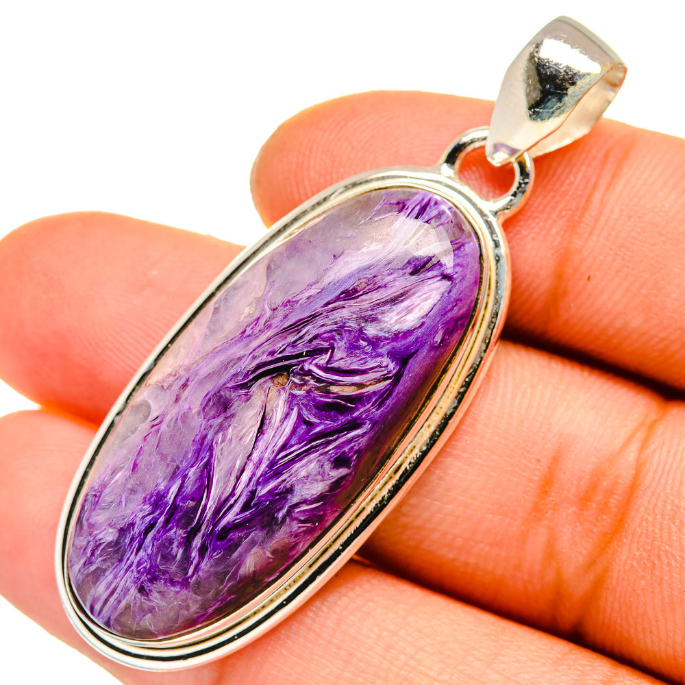 Charoite pendant with oval purple stone set in 925 sterling silver frame and bail
