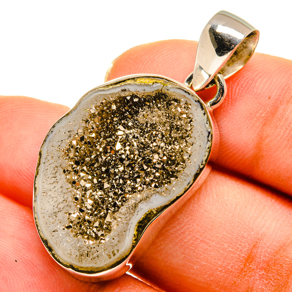 Pyrite geode slice pendant in silver bezel with gold glittery crystal center and bail.