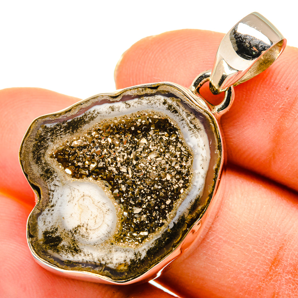 Pyrite geode slice pendant close-up, 925 sterling silver frame with textured gold crystal core