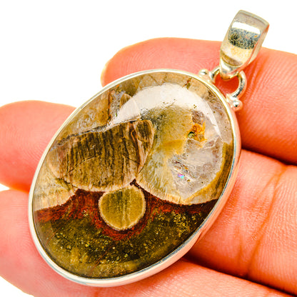 925 sterling silver mushroom rhyolite pendant with oval bezel and yellow-brown cabochon