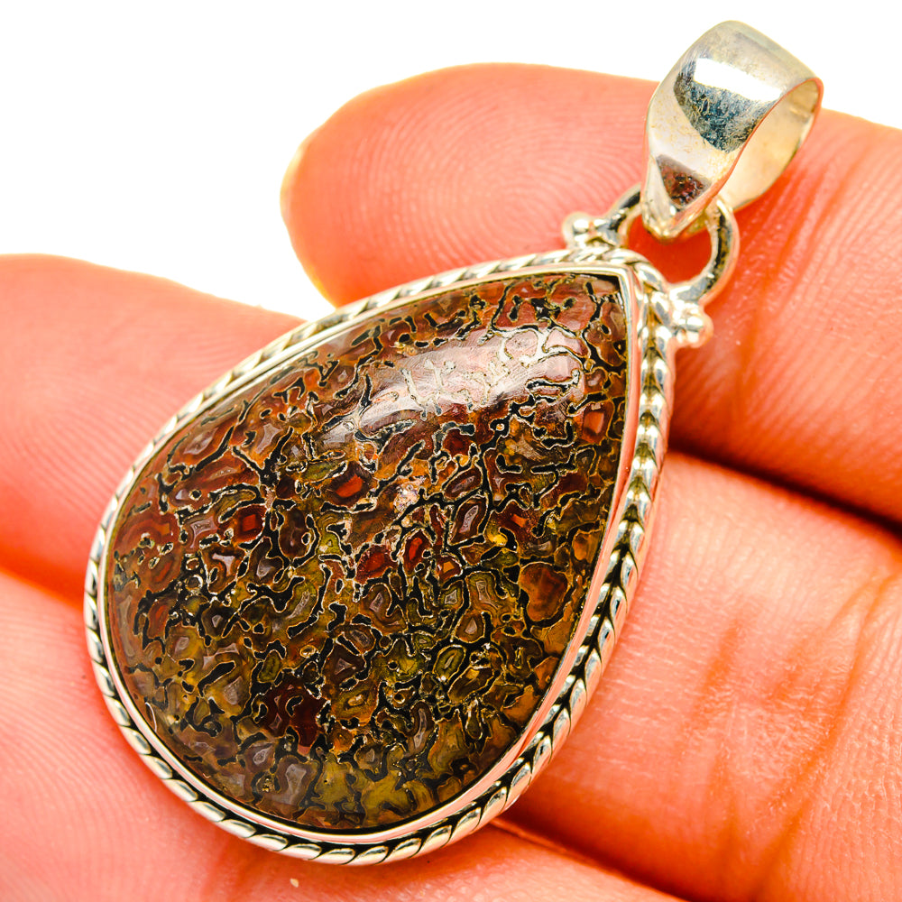 Dinosaur bone pendant, teardrop brown-green stone with silver bezel and bail