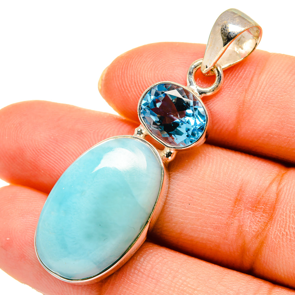 Sterling silver pendant with oval larimar and round blue topaz, bail loop at top