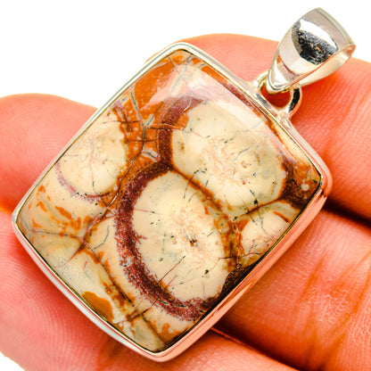 Close-up sterling silver poppy jasper pendant with square cabochon and loop bail