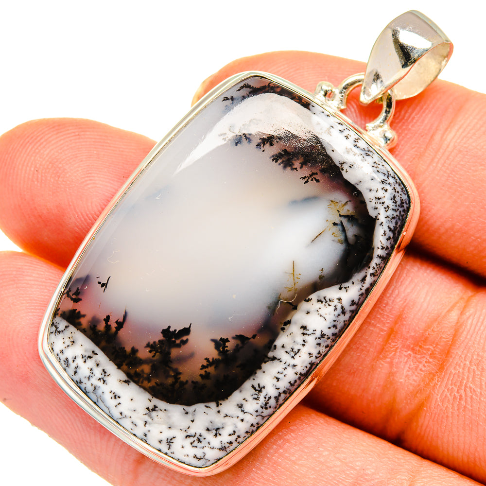 Sterling silver dendritic opal pendant with rectangular bezel and round bail