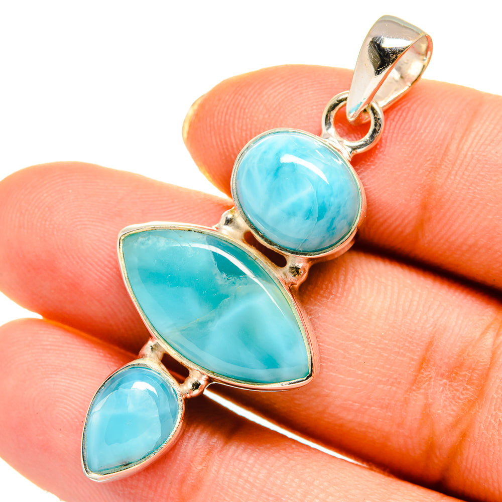 Larimar pendant with three teardrop turquoise-blue stones in gold-tone bezel