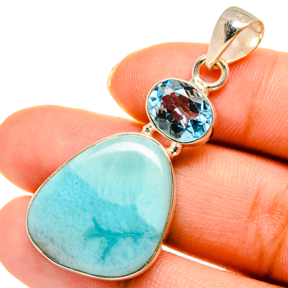 Sterling silver pendant with oval Larimar and blue topaz bezel