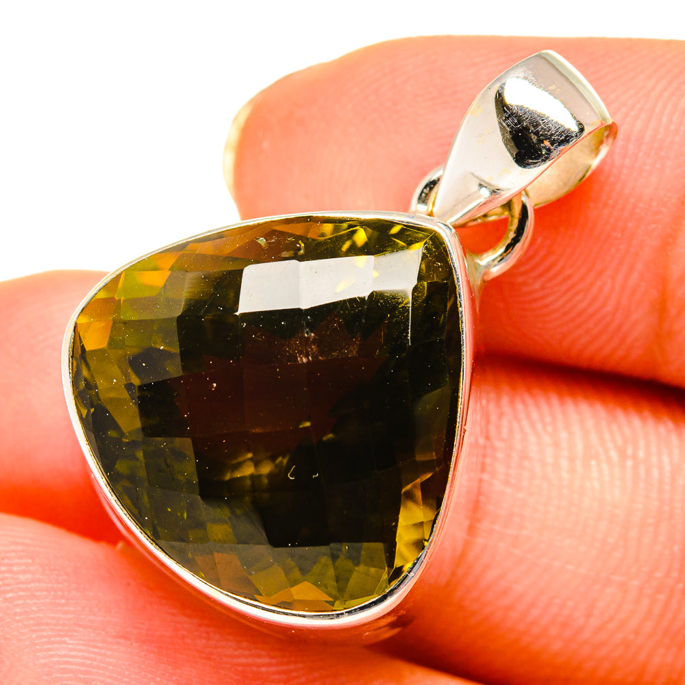 Faceted olive quartz teardrop pendant in polished sterling silver setting