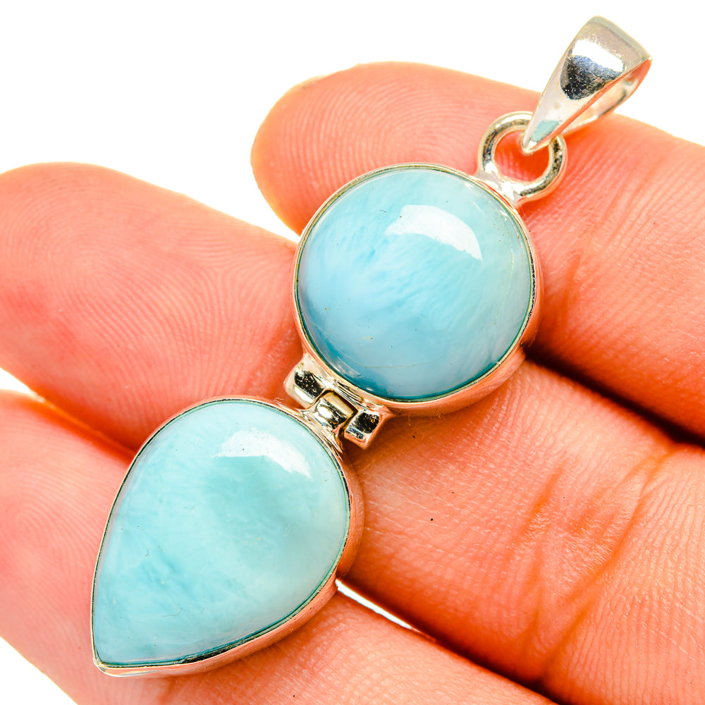 Larimar pendant in 925 sterling silver with two rounded light-blue stones and bail