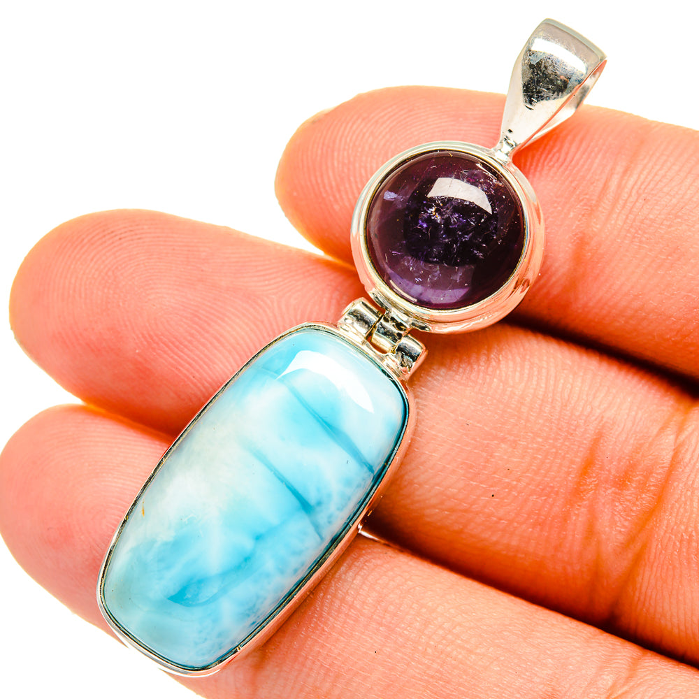 925 sterling silver pendant with blue oval stone and round purple tanzanite cabochon