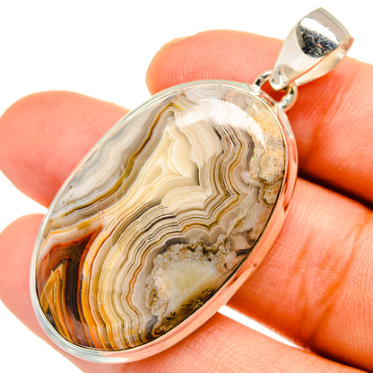 Sterling silver teardrop agate pendant with lace-patterned stone and top bail