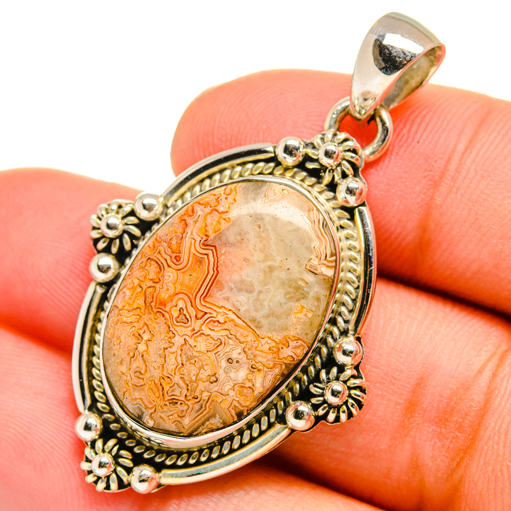 Orange lace agate pendant, oval 925 sterling silver frame with floral cutouts