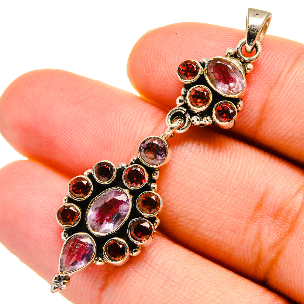 Sterling silver pendant close-up with pink rose quartz and red garnet round stones
