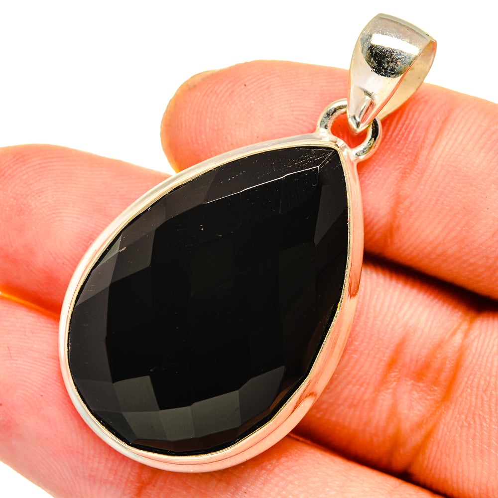 Black onyx teardrop pendant in 925 sterling silver bezel with loop bail