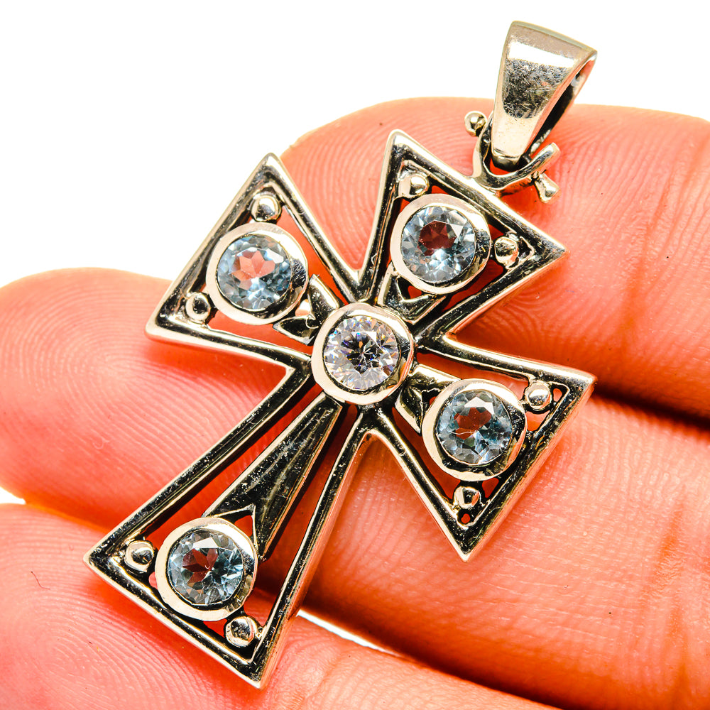 925 sterling silver blue topaz cross pendant, close-up with round blue stones