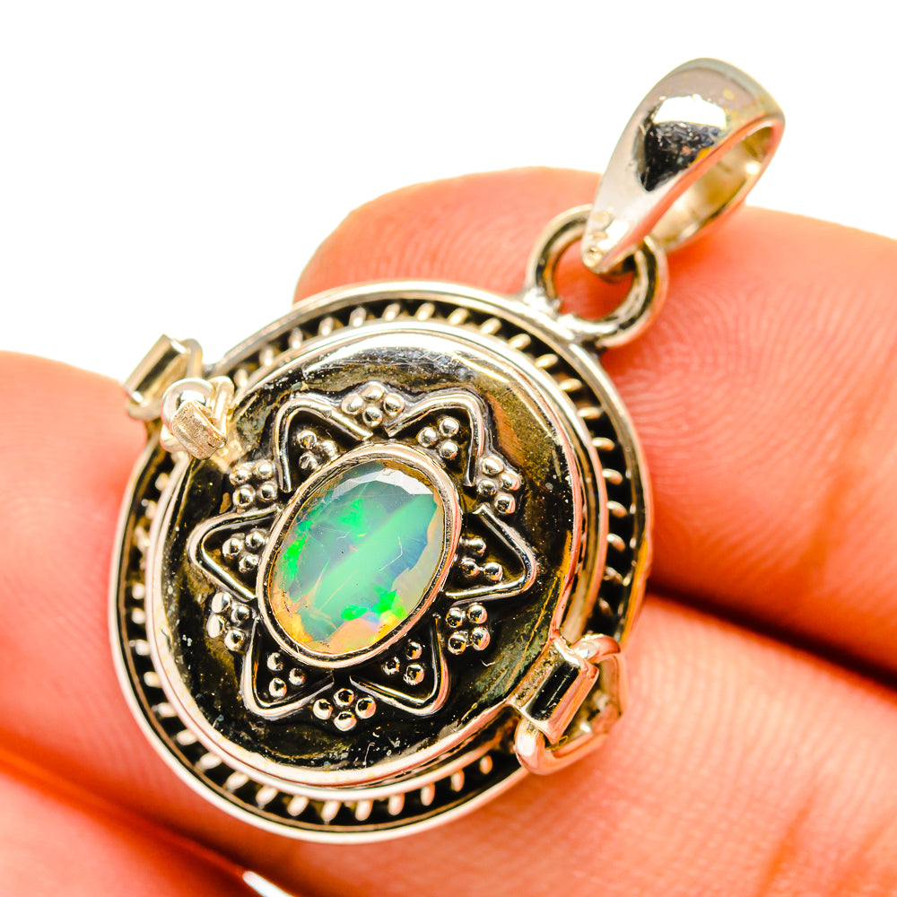 Opal pendant with oval multicolor Ethiopian opal cabochon in ornate gold-tone frame
