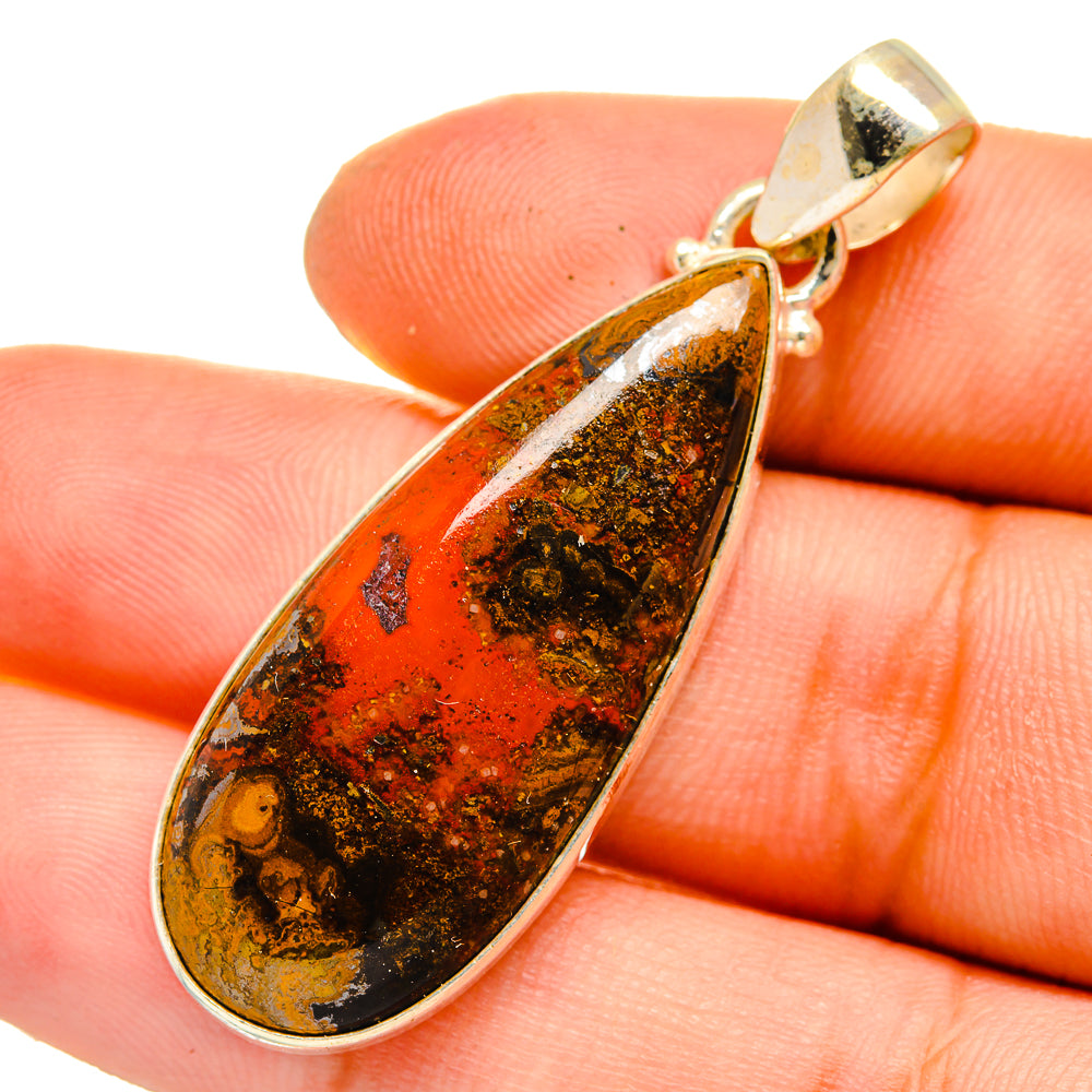Teardrop agate pendant with sterling silver frame, orange red stone with dark speckles