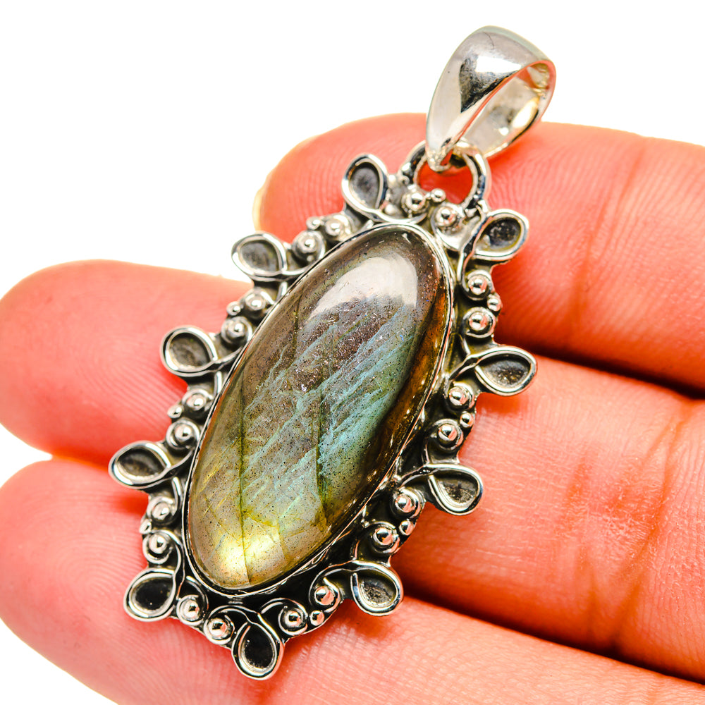 Labradorite pendant, oval green-blue stone in ornate sterling silver bezel