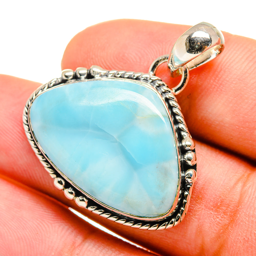 Larimar pendant in 925 sterling silver with teardrop blue gemstone and rope border
