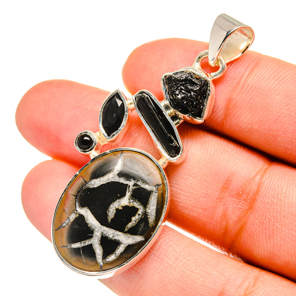 Black onyx-style geode pendant with sterling silver setting, teardrop shape