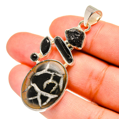 Black onyx-style geode pendant with sterling silver setting, teardrop shape