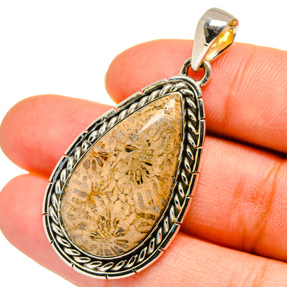 Fossil coral pendant with teardrop stone in ornate 925 sterling silver setting