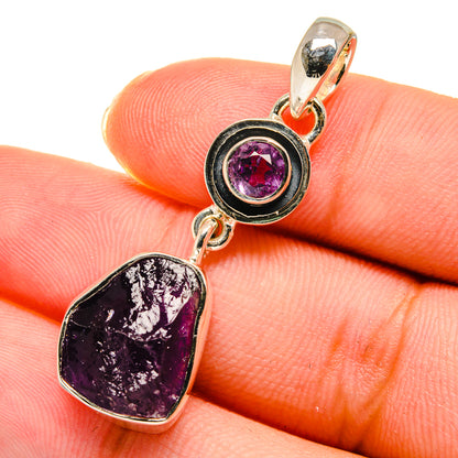 Sterling silver amethyst pendant close-up with purple rough stone and round bezel
