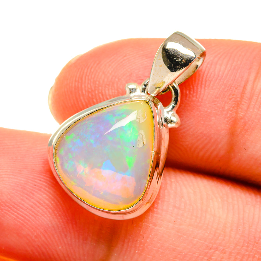Teardrop opal pendant in silver with green, pink, and blue flashes