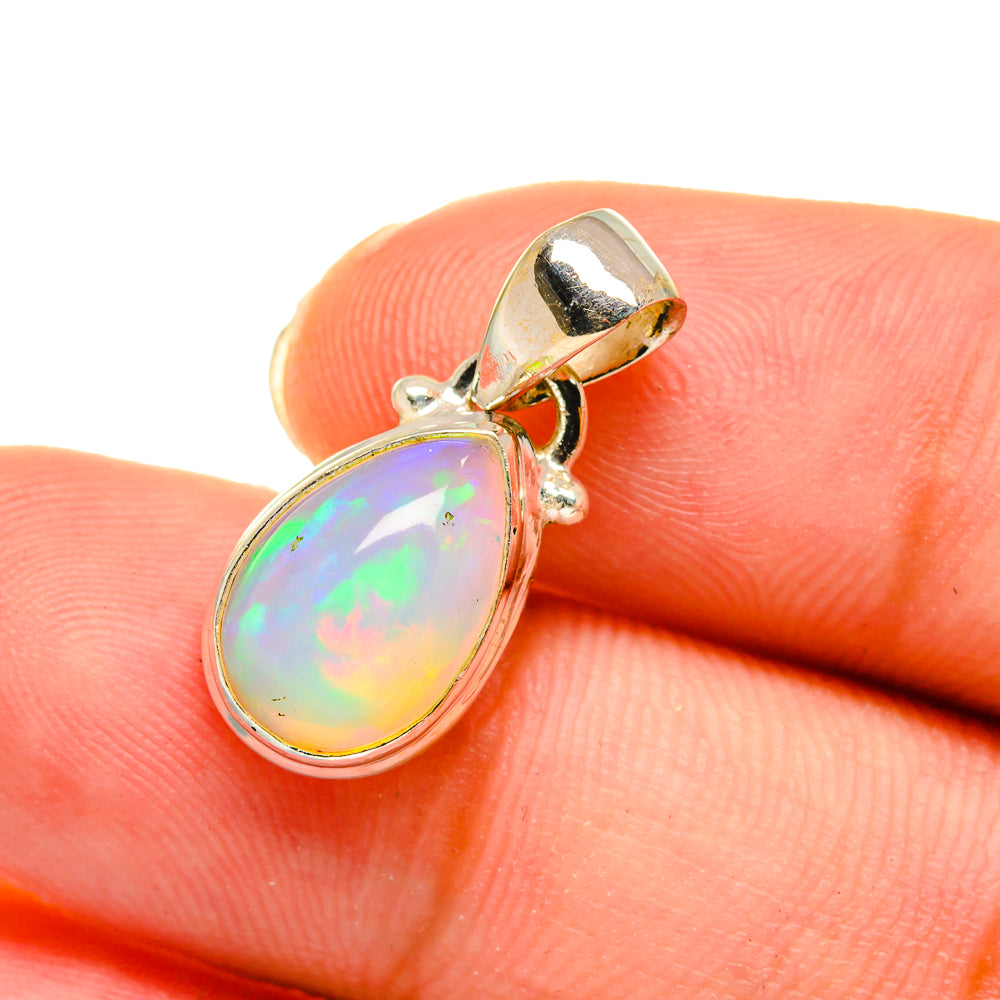 Opal pendant in 925 sterling silver, teardrop cabochon with prong and bail