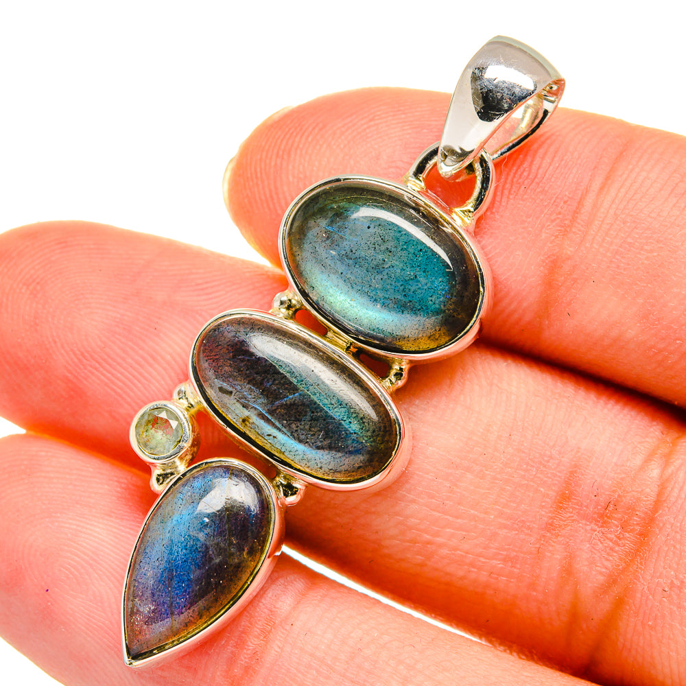 Labradorite pendant with three blue-green oval stones and round side stone, silver-tone setting