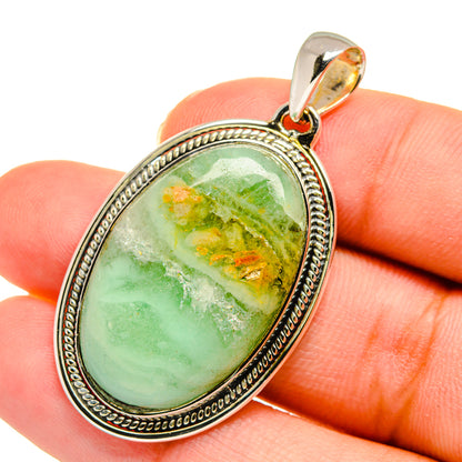 Ocean jasper pendant: oval green stone with orange flecks, sterling silver bezel and bail